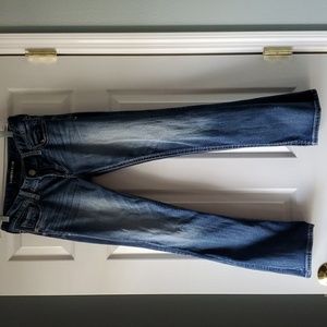 Express distressed stretch Jean mid rise. Perfectly broken in